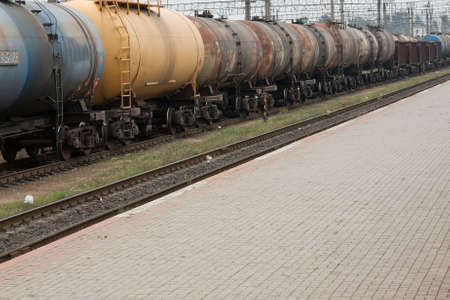 Old rusty oil transporting freight train wagonsの写真素材