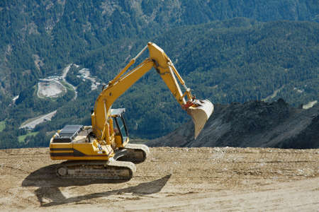 Excavator machine at a high mountain construction siteの写真素材
