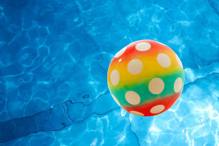 Ball over the rippling surface of a poolの写真素材