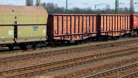 Old freight train wagons on railway tracks