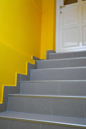 Stairs leading to a closed doorの写真素材