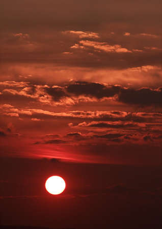Sunset sky with glowing cloudsの写真素材