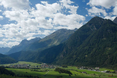 Alpine landscape with mountains and valleyの写真素材