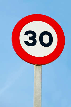 Speed limit traffic sign showing 30の写真素材