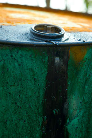 Old, leaking oil barrelの写真素材