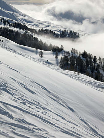 Mountain landscape with clouds and snowの写真素材