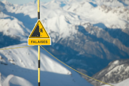 Warning sign and safety rail in the mountainsの写真素材