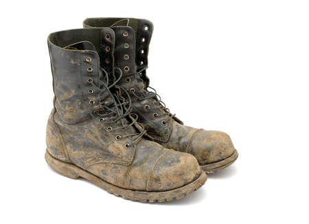 Muddy boots isolated on white background Muddy boots isolated on white background
