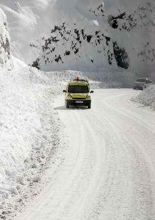 Hard driving condition on mountain road in winterの写真素材
