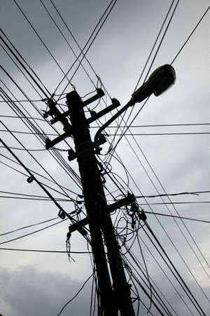 Chaotic wires on an electric pillarの写真素材