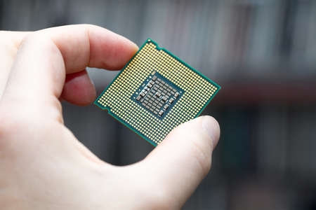 Computer CPU in human handの写真素材