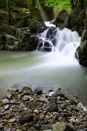Small waterfall with blurred water surfaceの写真素材
