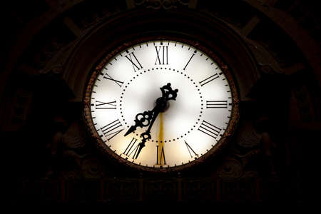 Big, old clock of a railway stationの写真素材