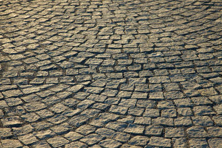 Old pavement in sunset lightの写真素材