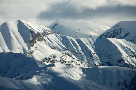 High mountains with winter snowの写真素材