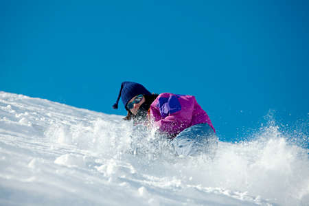 Skier coming down a steep slopeの写真素材