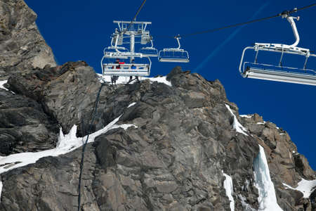 Ski lift at a steep, rock placeの写真素材