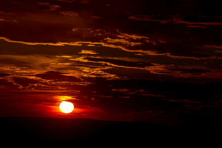 Dramatic sunset sky with cloudsの写真素材