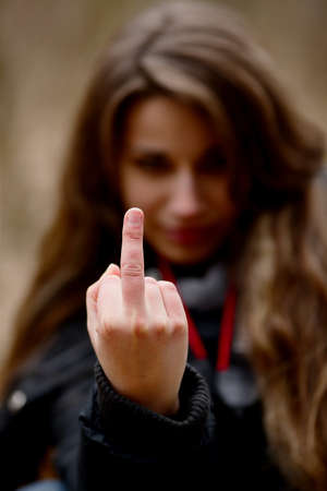 Woman showing middle finger signの写真素材