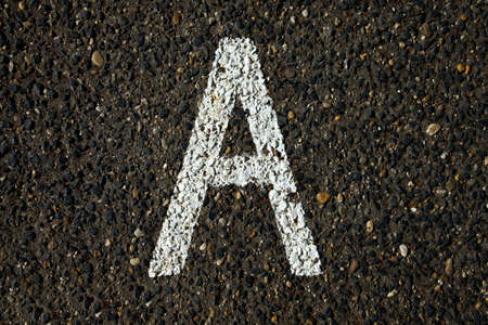 Letter A painted on asphalt surfaceの写真素材