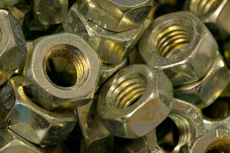 A pile of metal nutsの写真素材