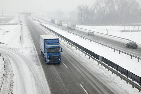Highway traffic in heavy snowfallの写真素材
