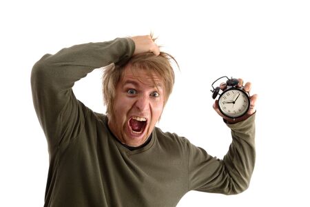 Outraged man with alam clock in handの写真素材