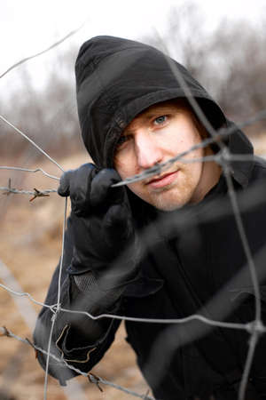 Hooded man outdoor portraitの写真素材
