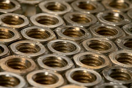 Array of metal nutsの写真素材