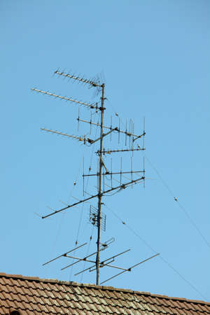 Old aerials on a rooftopの写真素材