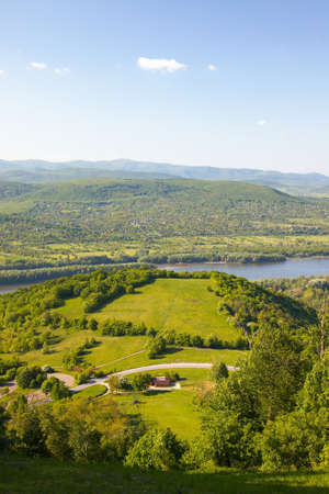 Hilly landscape with riverの写真素材
