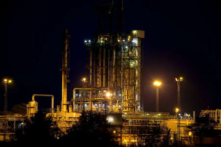 Oil refinery building at nightのeditorial素材