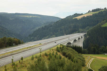 Highway with viaduct over a valleyの写真素材