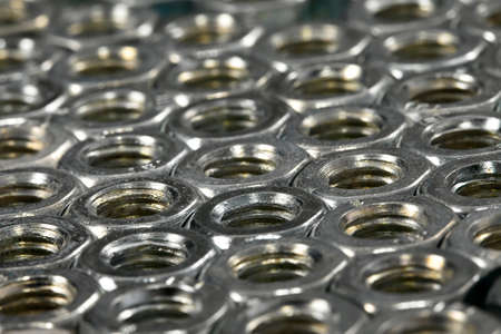 Array of metal nutsの写真素材