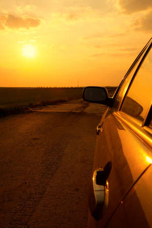 Side detail of a car in the sunsetの写真素材