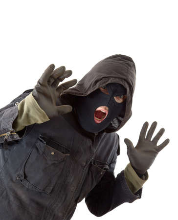 Surprised burglar in black maskの写真素材
