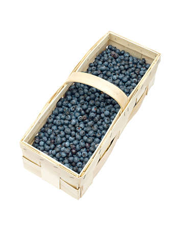 A basket of blueberries isolated on whiteの写真素材