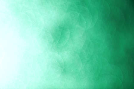 Smooth green background of unfocused lightsの写真素材