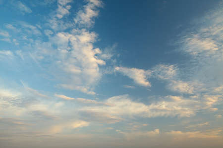 Clouds in soft sunset lightの写真素材