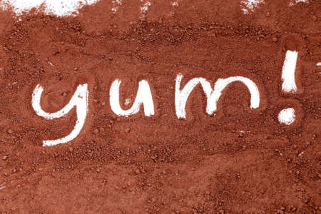 cocoa powder with yum written in itの写真素材