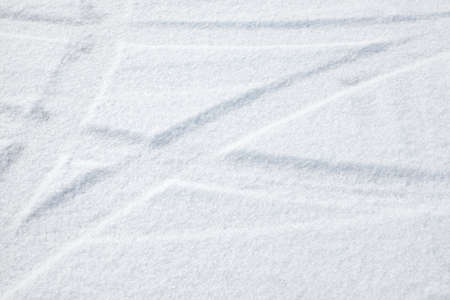 Trails of wheels in fresh snowの写真素材