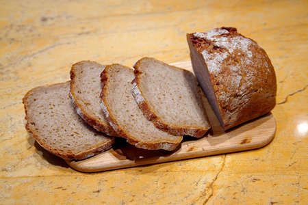 Sliced loaf of bread on the tableの写真素材