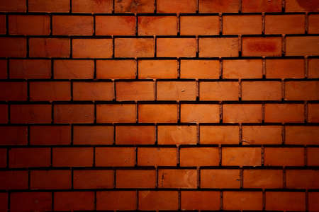 Red brick wall in artificial lightの写真素材