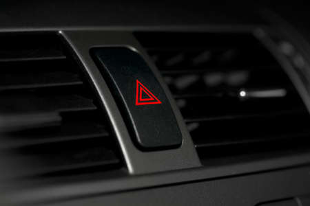 Emergency sign button on the dashboardの写真素材
