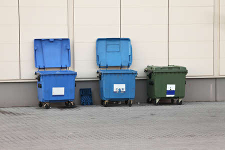 Garbage dumpers at the side of a buildingの写真素材