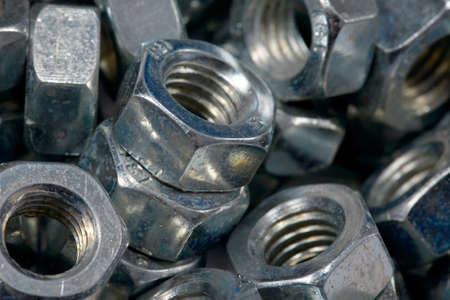 A pile of metal nutsの写真素材