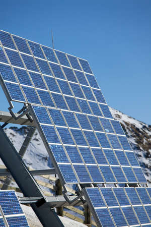 Big cluster of solar panels on a mountain peakの写真素材