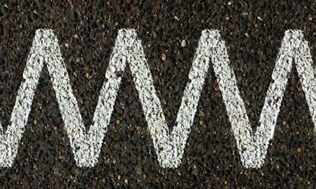 Line painted on asphalt surfaceの写真素材