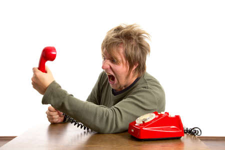 Angry man shouting on the phoneの写真素材