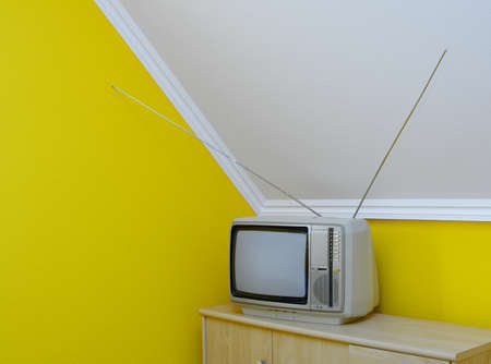 Old, vintage tv set in the corner of the room の写真素材